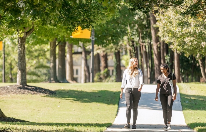 two women walking in a park in Brookhaven, GA