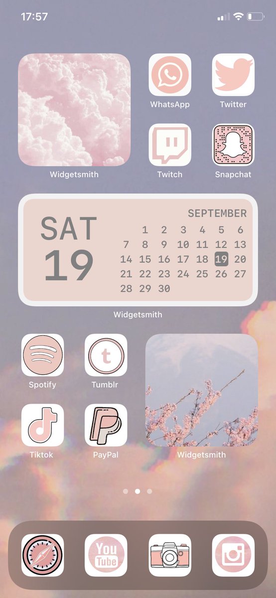 iPhone’s home screen customized with pastel-colored app icons and widgets