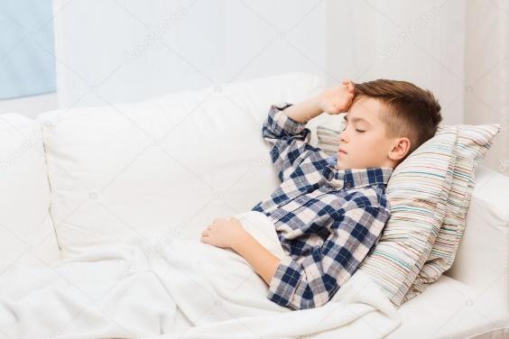 Ill boy lying in bed and suffering from headache ⬇ Stock Photo, Image by ©  Syda_Productions #92520110