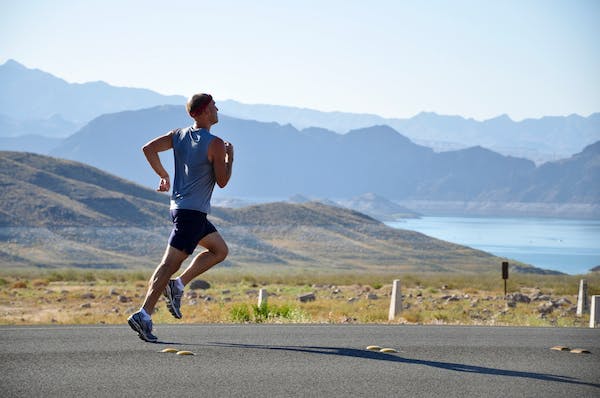 man running on road, track and field, sprinting, hurdles, running, cardio, strength, speed