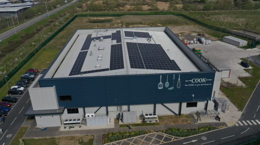 Images shows an aerial view of the solar panels on the roof of the Cook Classics Kitchen warehouse