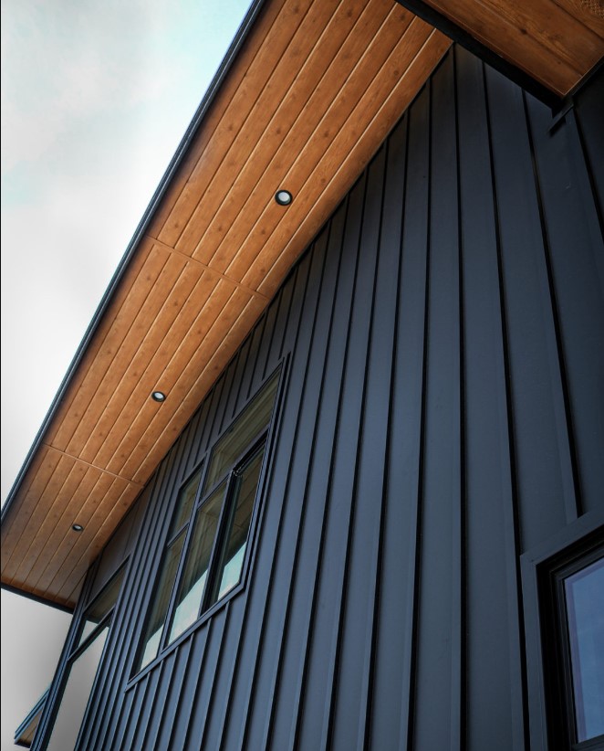 wood accent soffit with =black board and batten siding on a home