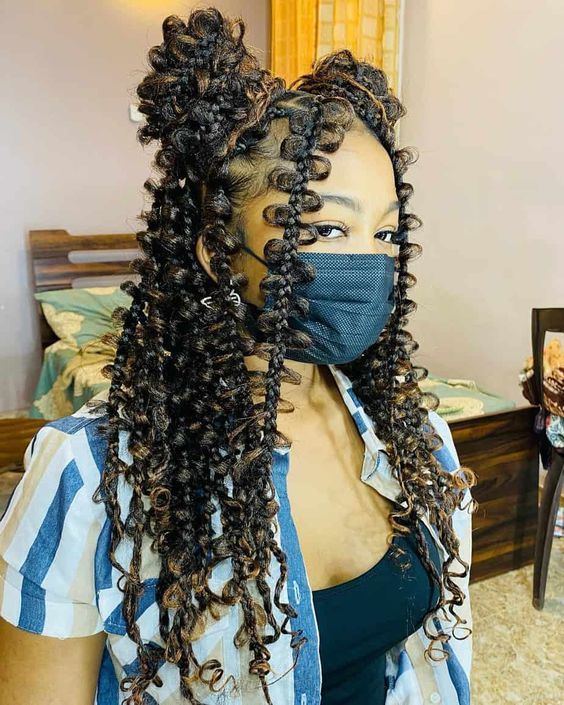 lady with butterfly braids wearing face masks