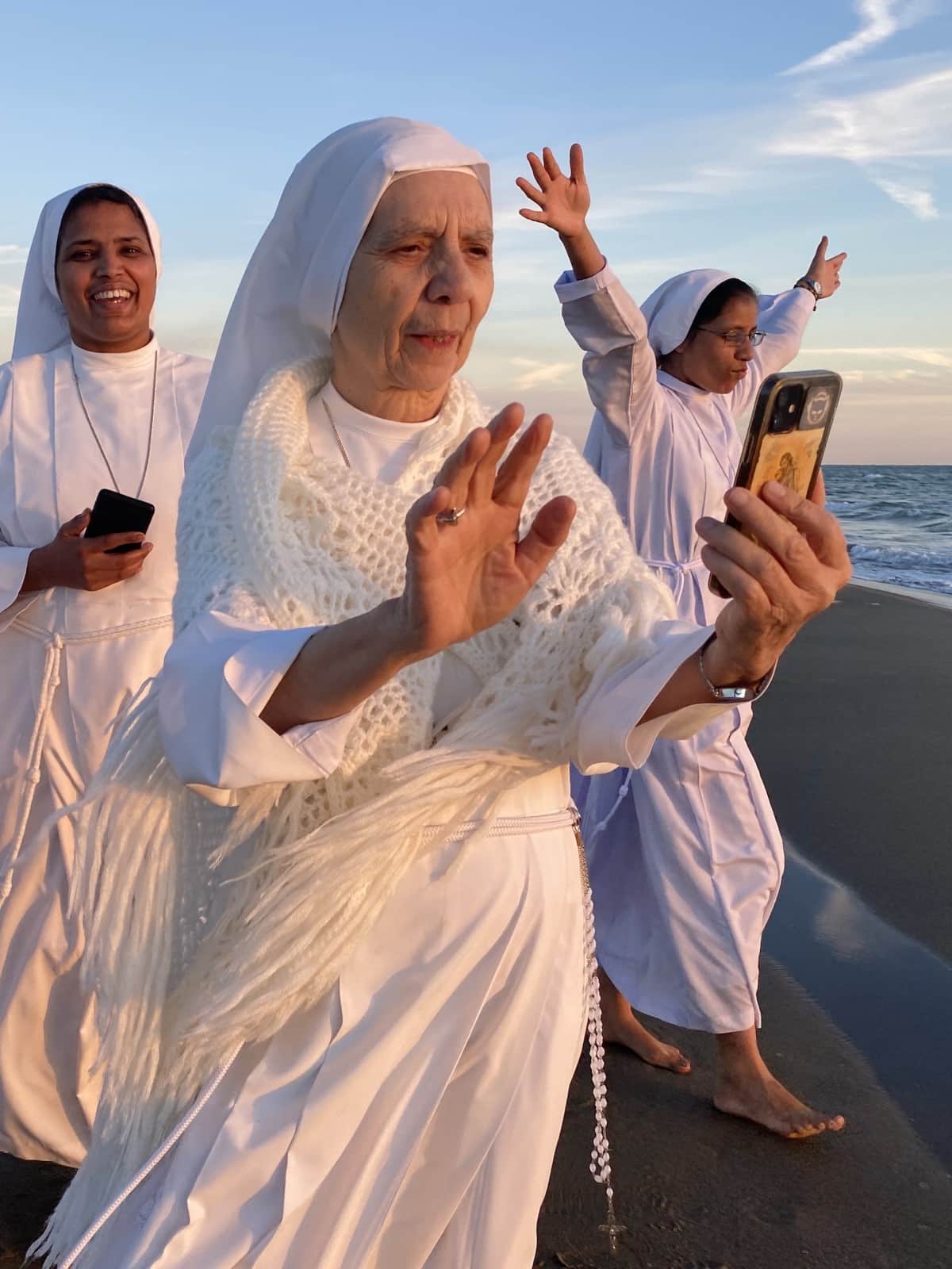 Happy Nuns Walking on the Beach