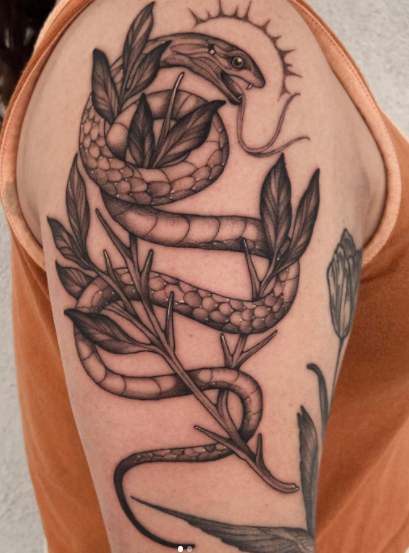 Adorable Snake With Leaf Tattoo Design On Shoulder