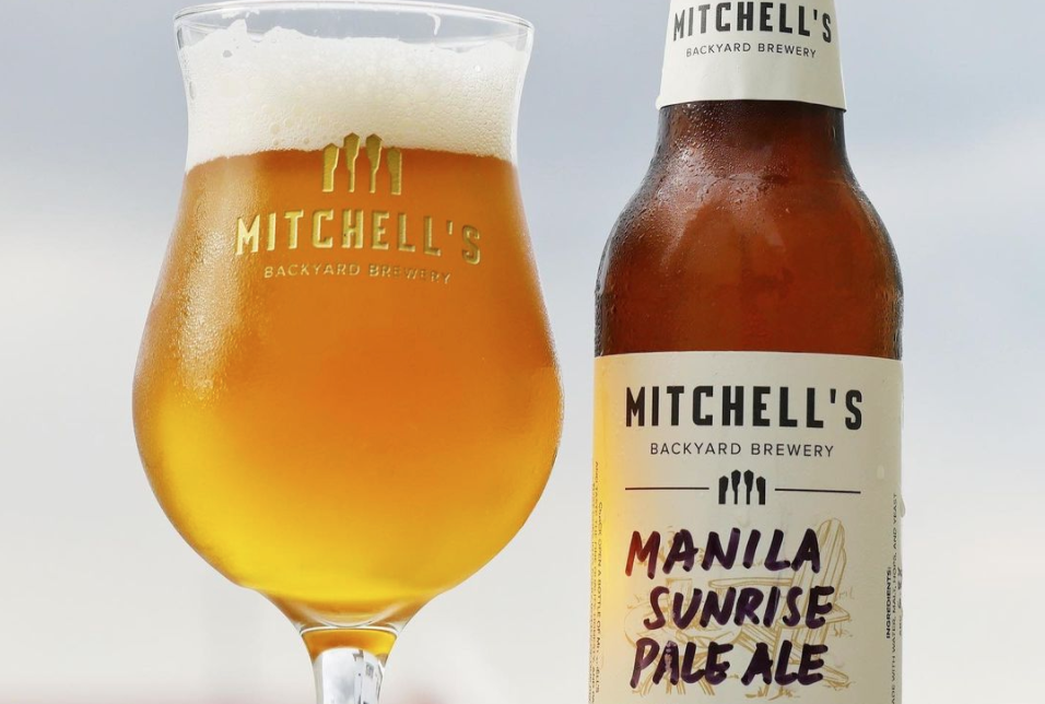 A glass of Manila Sunrise Pale Ale Mitchells Backyard Brewery