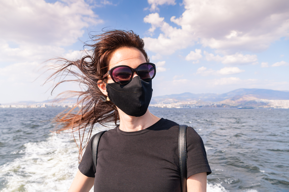 Lady wearing mask on board a cruise ship
