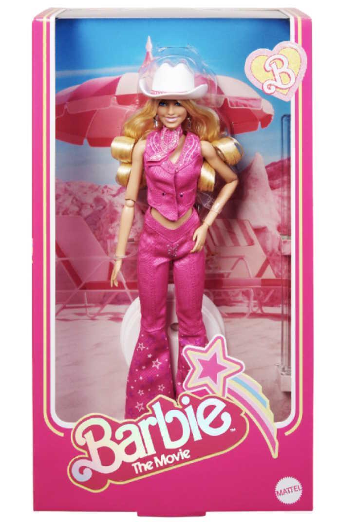 A barbie doll in a box

Description automatically generated