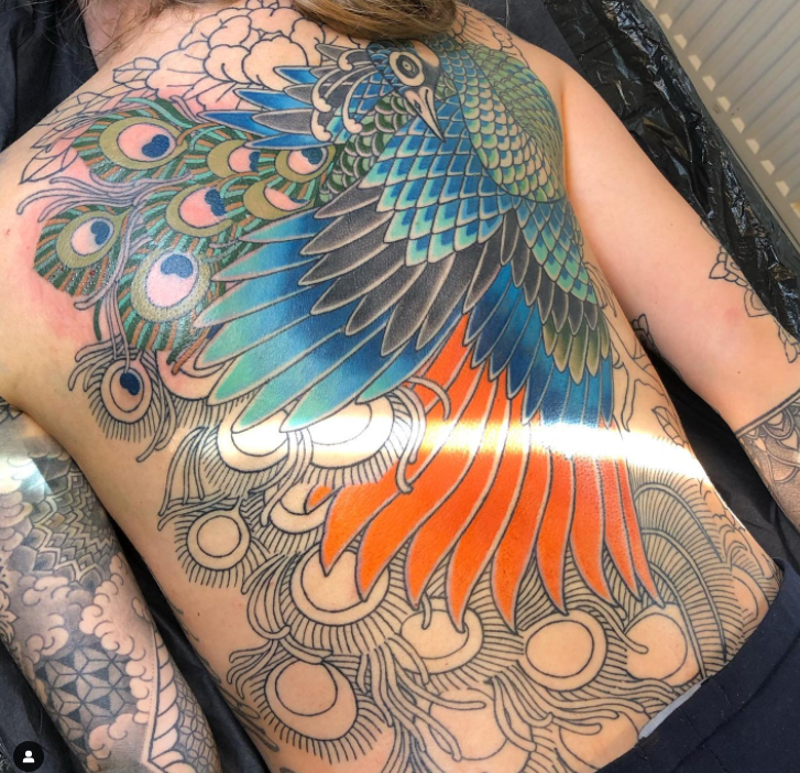 Incredible Blue Peacock Tattoo On Back