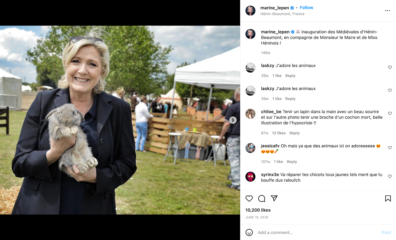 Marine Le Pen holds a rabbit while smiling