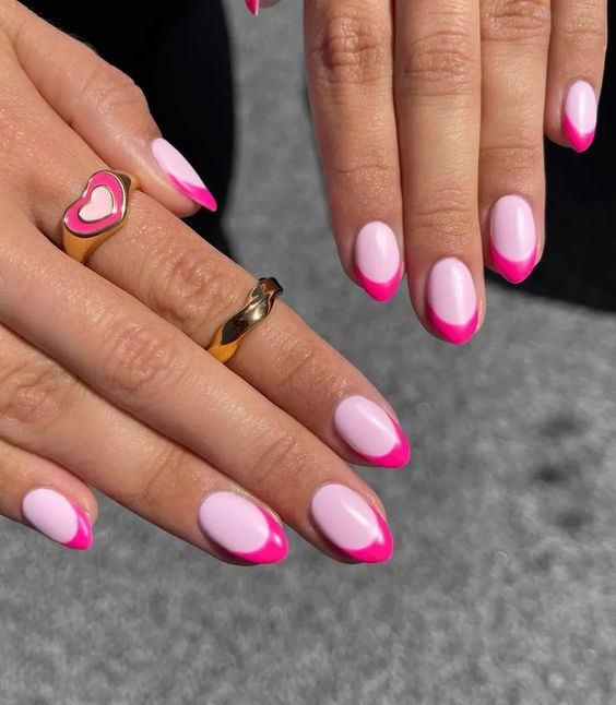 Lady shows  off her cute bright pink and dark pink nails
