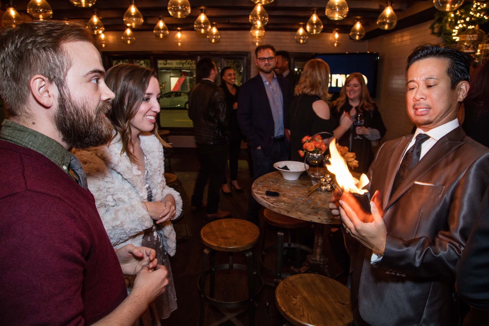 Close up magician performing a card trick at a wedding reception