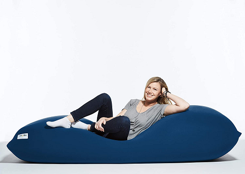 woman lounging on a blue bean bag