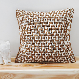 mosaic crochet pillow on table