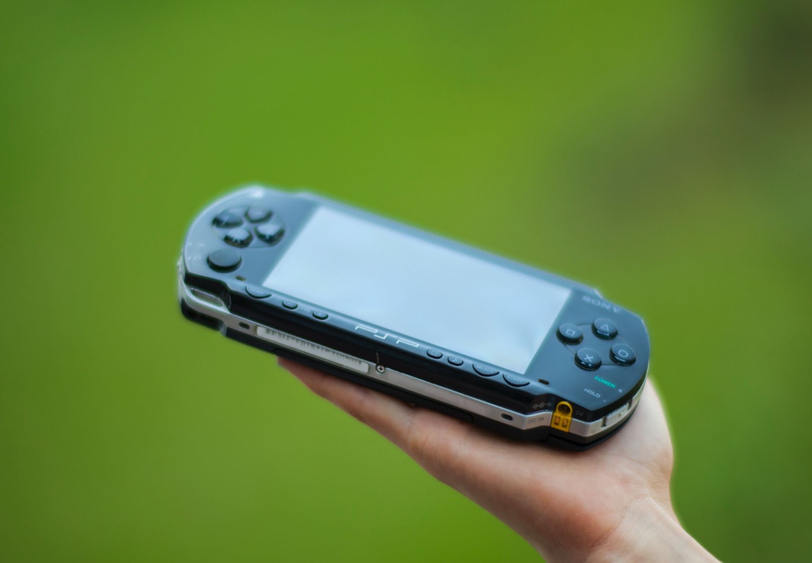 A game console in somebody's hand