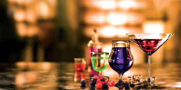 Group of exotic cocktails on an out of focus and colorful background. Cocktail and mixology. 3d illustration. stock photo