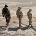 Two American soldiers and a member of the Afghan military looked for caves with weapons caches near Kandahar in February.