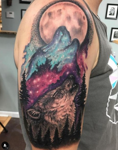 Awesome Colorful Howling Alpha Wolf Tattoo Design