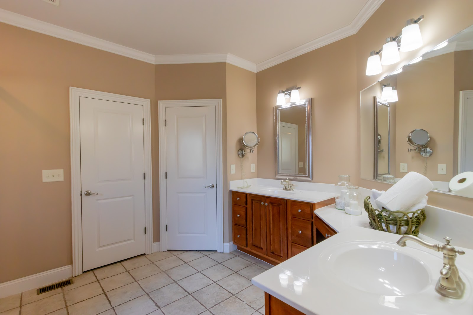 You can place a few non-bulky items on the master bathroom counters if you don't want to leave them bare when staging.