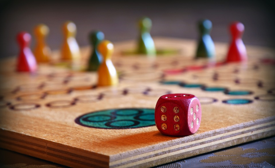 close-up photo of board game with dice and pieces