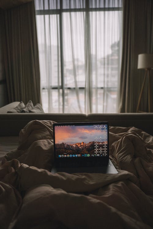 Free A Laptop in Bed Stock Photo