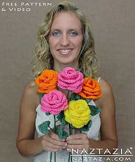 woman holding a bouquet of crochet roses