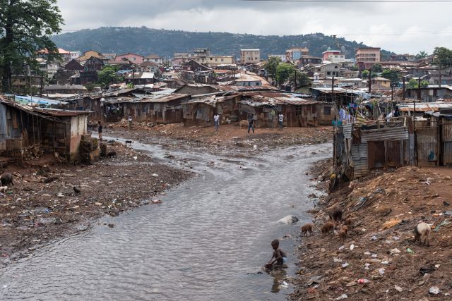 The river that runs through the Kroo Bay slum community in Sierra Leone. Credit: Save the Children