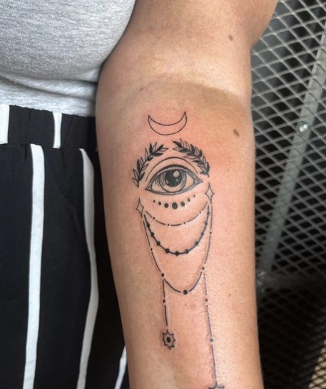 Half Moon Evil Eye Tattoo