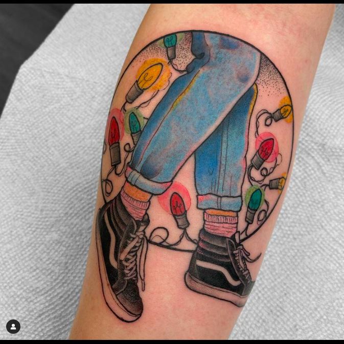 Faded Jeans With Christmas Lights Tattoo