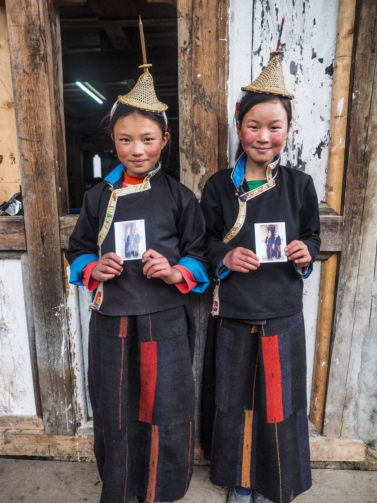 Two young Layap´s posing with their Polaroid photo.
