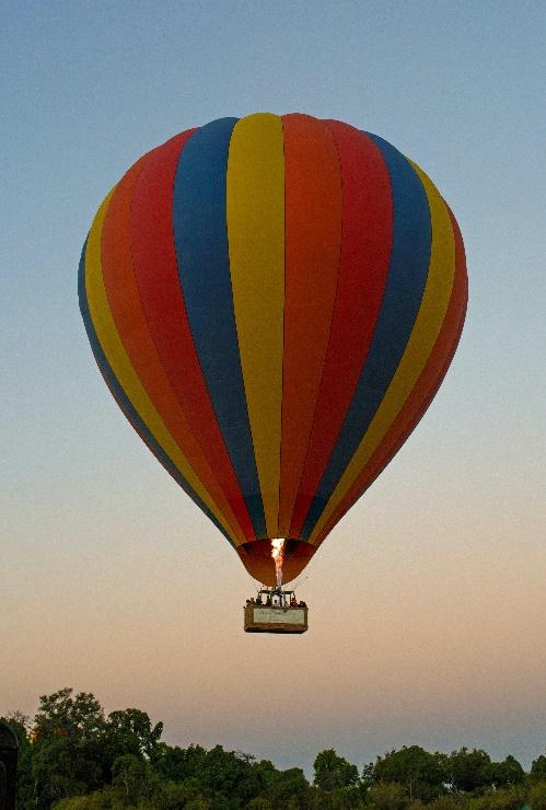 A hot air balloon in the sky

Description automatically generated