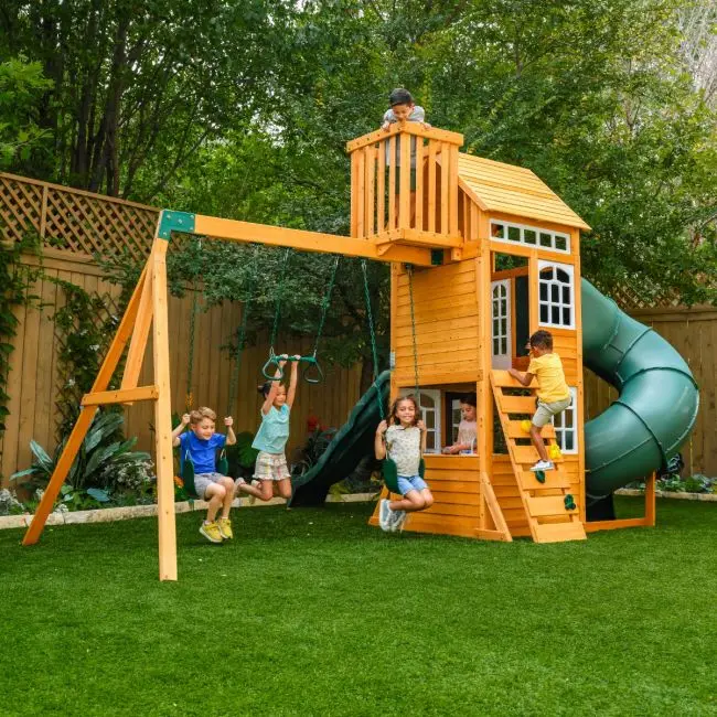 Children swinging and climbing on a swing set