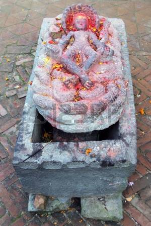 24305388-stone-vishnu-god-near-temple-changu-narayan-near-bhaktapur-nepal.jpg