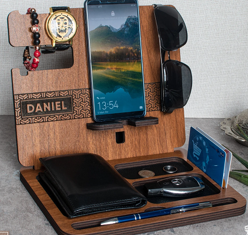 wooden organizer holding phone, glasses, watch and wallet