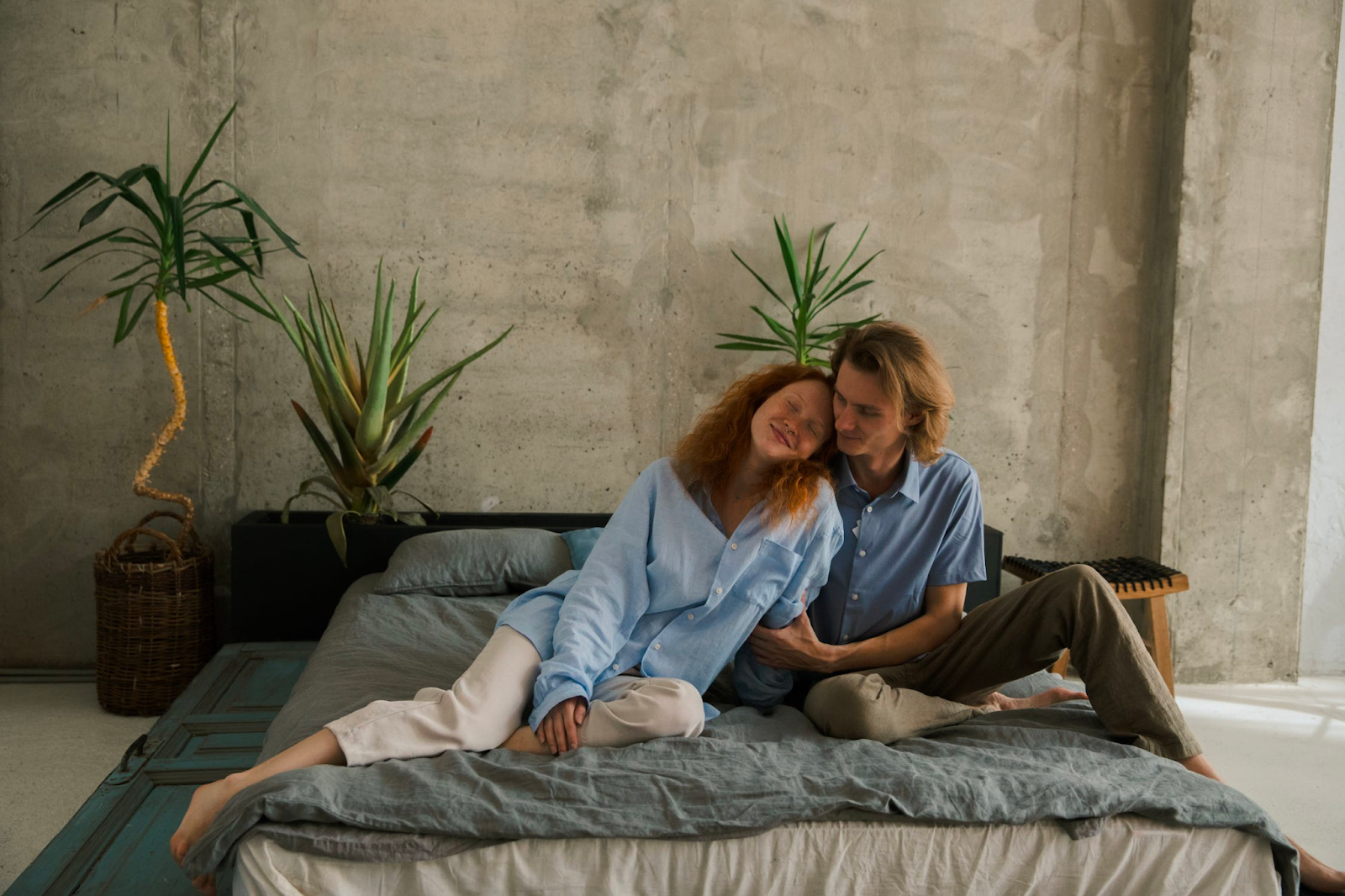  a happy couple sitting in bed