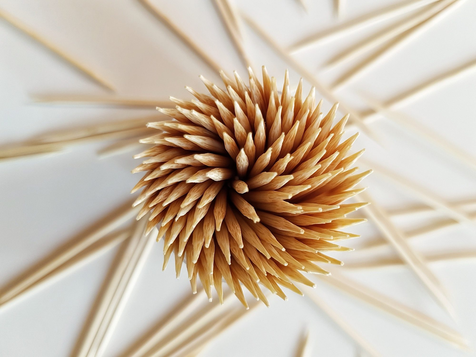 Use a toothpick to shake the pollen off the flower