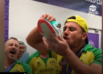 Australia won T20 world cup, celebrating by Drinking shampain by shoes.