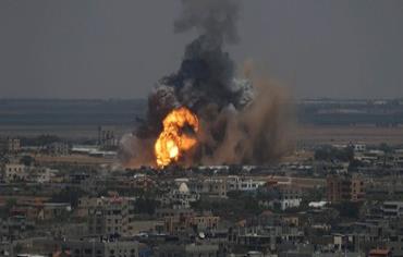 Smoke and flames are seen following what police said was an Israeli air strike in Rafah in the southern Gaza Strip July 8, 2014. Operation Protective Edge