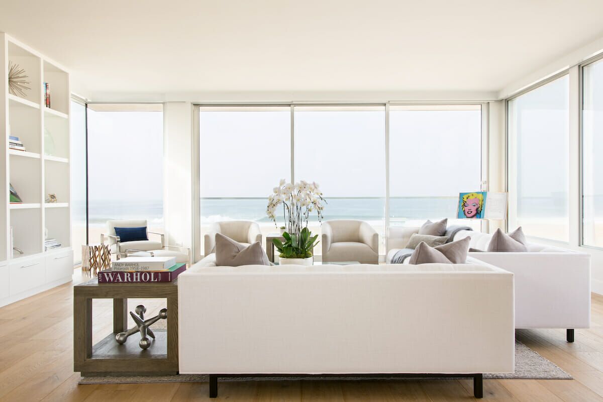 Living room with ample natural lighting by Decorilla designer Jordan S