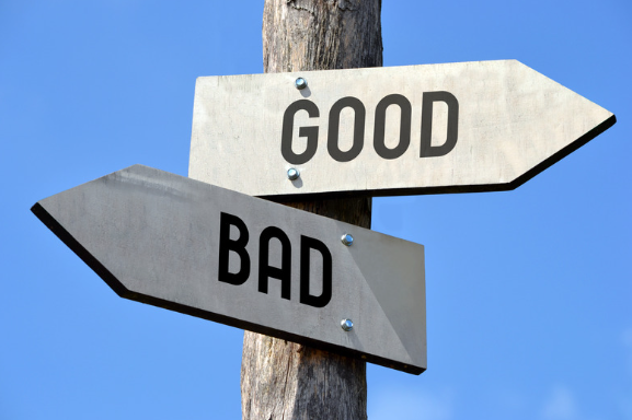 A sign post with two signs labelled "Good" and "Bad"
