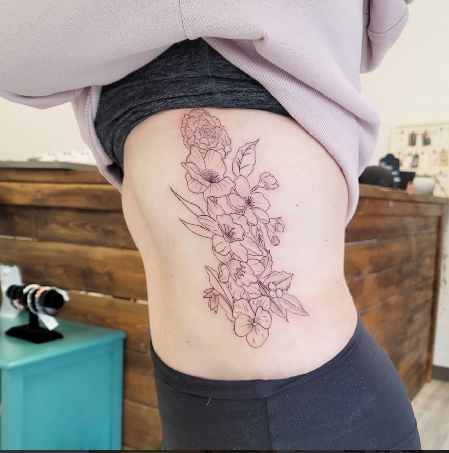 Flower Themed Rib Tattoos 47
