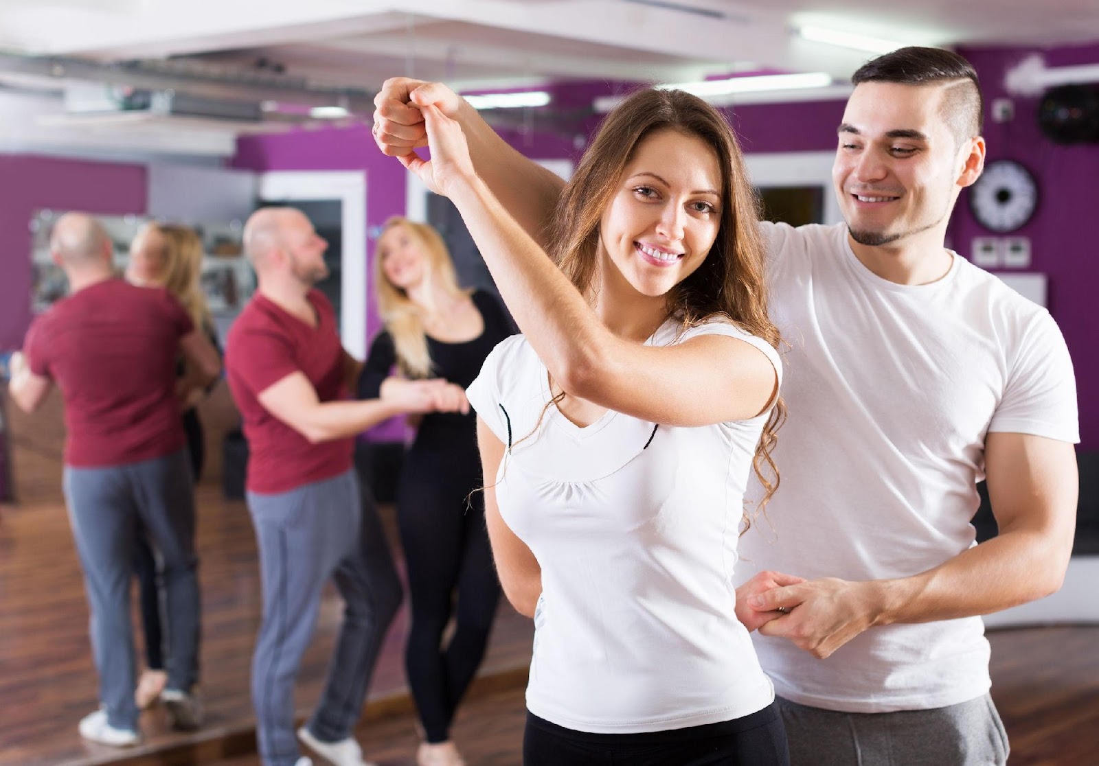 Couple taking dance lessons for their wedding reception