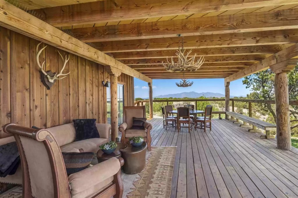 An expansive wood-beamed porch.