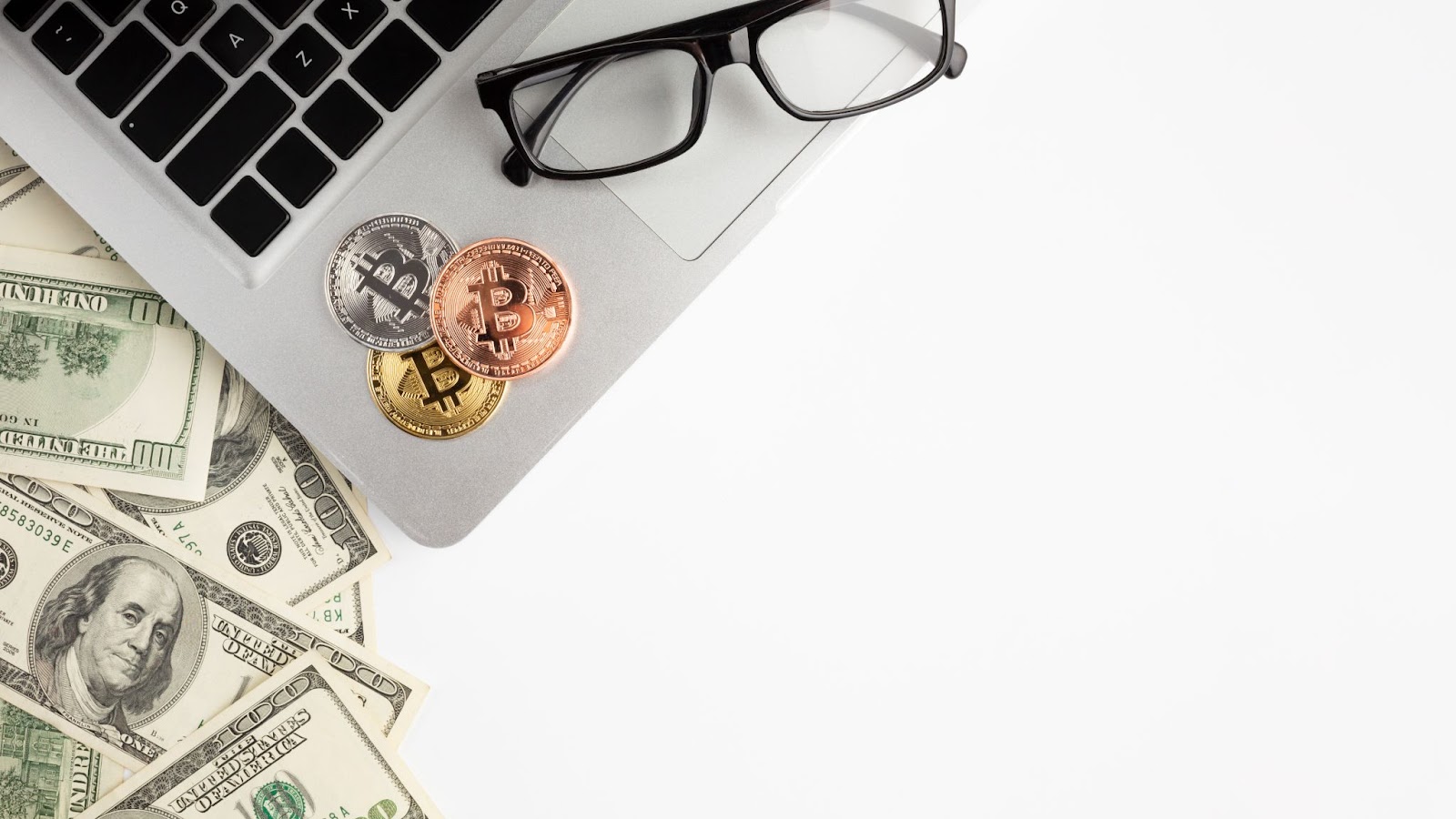 laptop-with-eye-glasses-coins-money