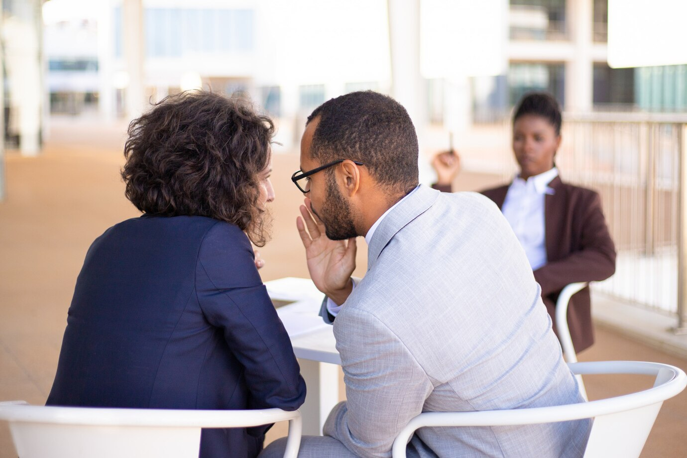 A man and a woman gossiping