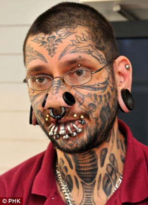 Man with face tattoo liberal loser