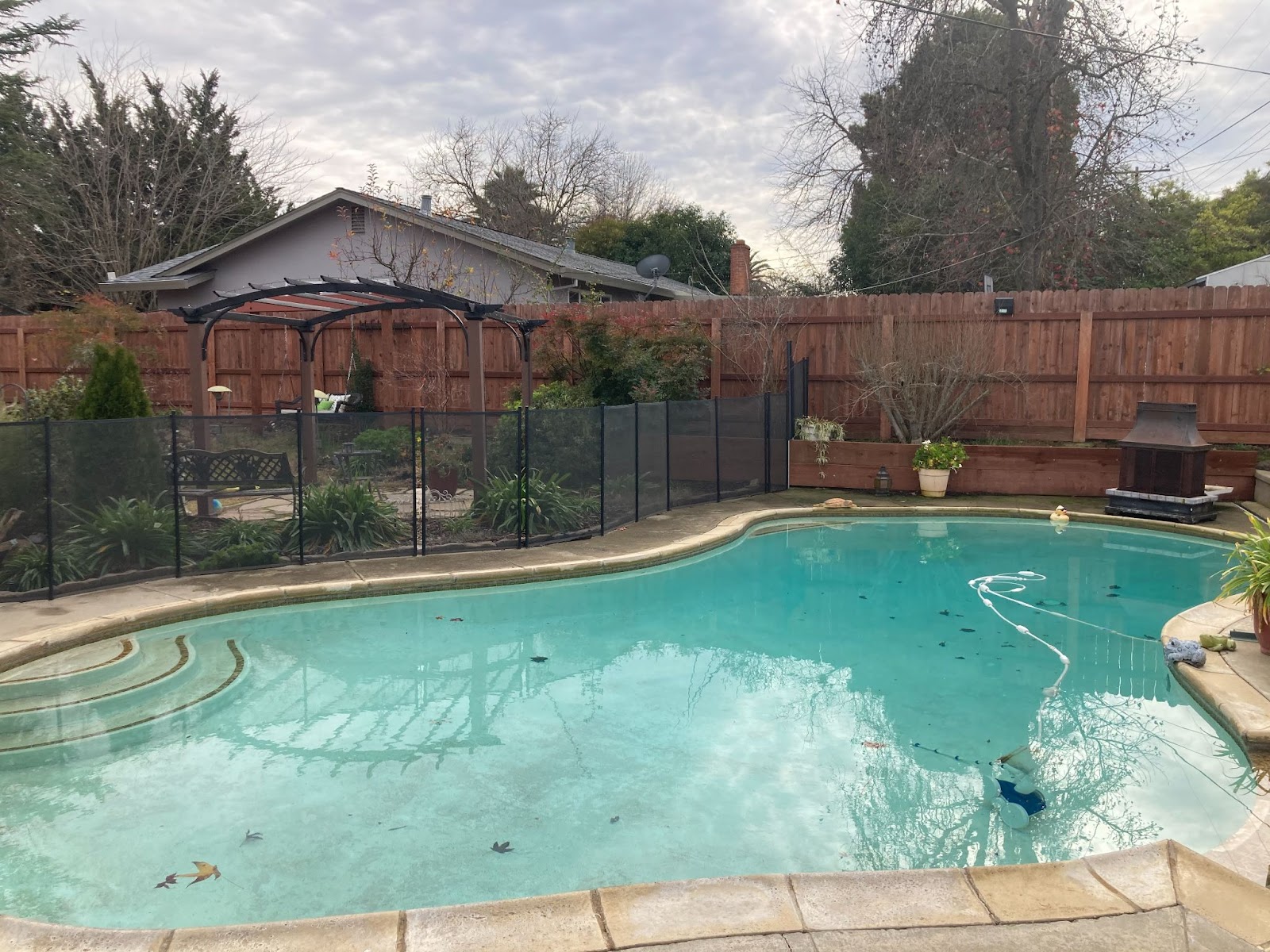 Black mesh pool fencing installed