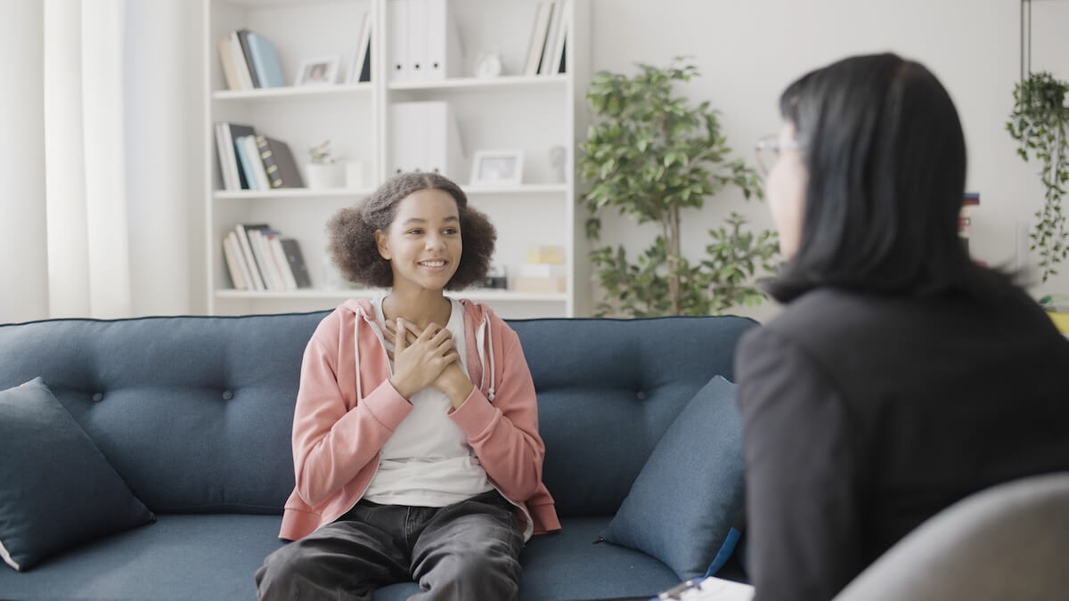 Young patient talking to a woman