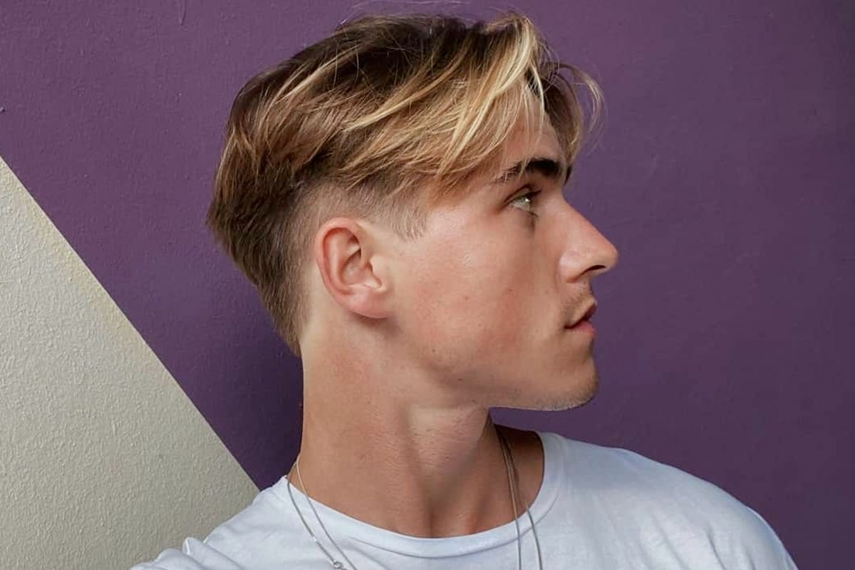 Picture showing a guy rocking the middle part undercut