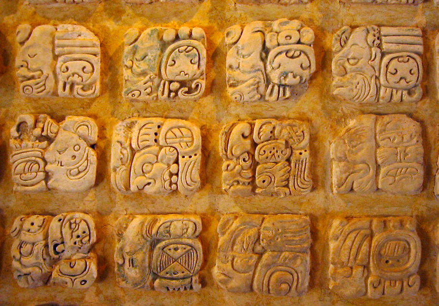 Maya stucco glyphs displayed in the Palenque museum, Mexico